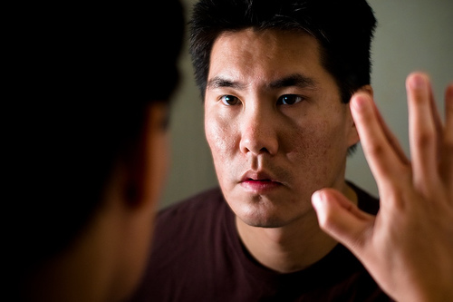 Man looking in the mirror